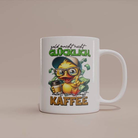 Video: Witzige Enten Tasse mit dem Spruch „Geld macht nicht glücklich, außer man kauft Kaffee“